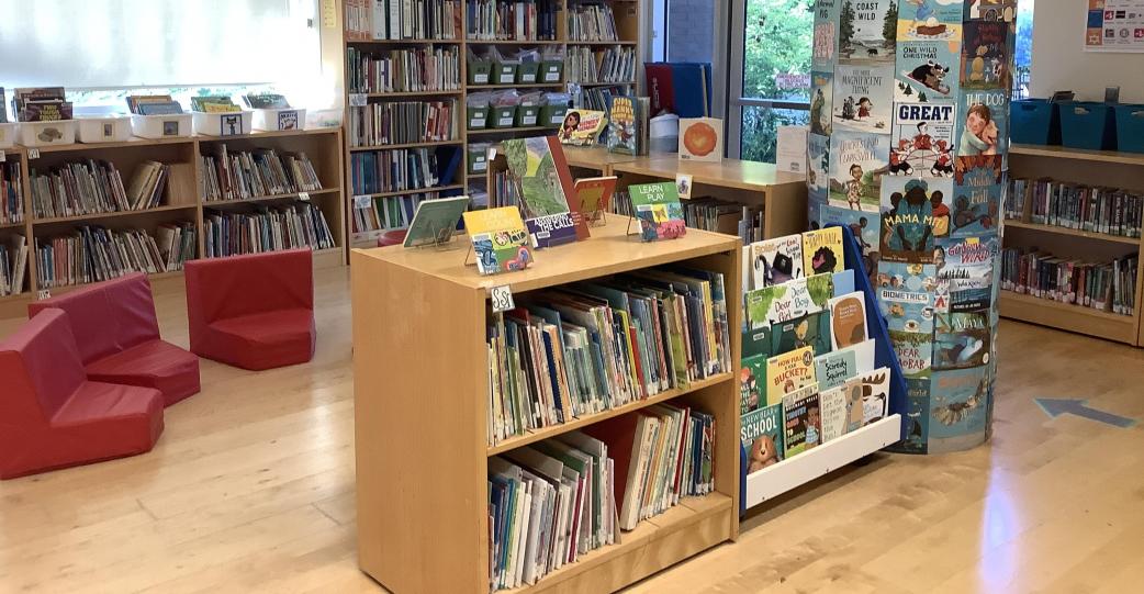 14 picture books arranged on a table