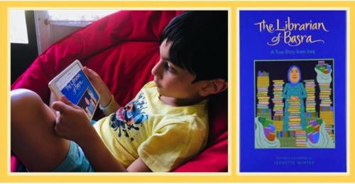 young boy in bean bag chair reading